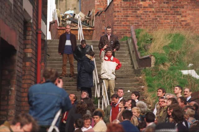 The band filming in an alleyway off Darlington Street