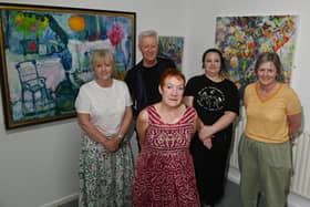 Artists, from left, Debra Bundenberg, Brian Whitmore, Jane Fairhurst, Emma Saunders and Wendy Chapman, enjoy the new exhibition hosted by Cross Street Arts, Standish.