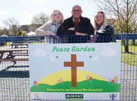 Carl Bramhall, centre, with daughters Kammalah, left, and Tegan, right, the husband and daughters of the late Julie Bramhall at the Peace Garden official opening.