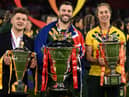 All three captains with their team's trophies (Photo by OLI SCARFF/AFP via Getty Images).