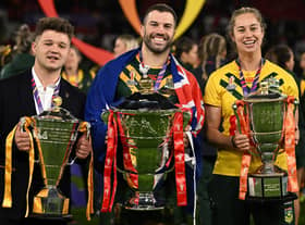 All three captains with their team's trophies (Photo by OLI SCARFF/AFP via Getty Images).