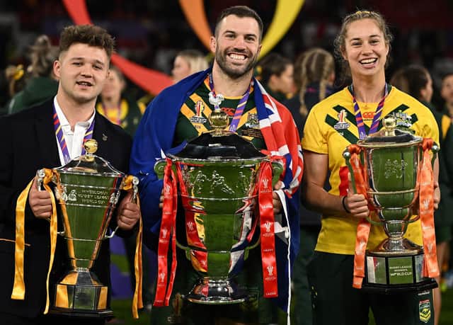 All three captains with their team's trophies (Photo by OLI SCARFF/AFP via Getty Images).