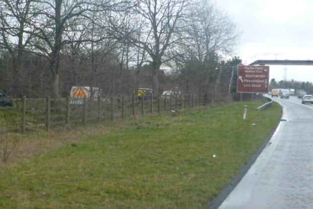 Police at the scene where Christopher Hughes's body was found near to the M58 at Skelmersdale 