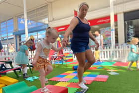 Two-year-old Eadie enjoys the play area at the Spinning Gate shopping centre