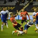 Latics were denied a penalty in the second half for this challenge on Tom Naylor