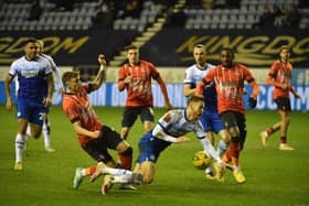 Latics were denied a penalty in the second half for this challenge on Tom Naylor