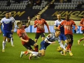 Latics were denied a penalty in the second half for this challenge on Tom Naylor