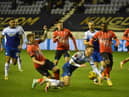 Latics were denied a penalty in the second half for this challenge on Tom Naylor