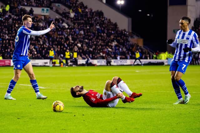 Liam Shaw concedes a penalty in the FA Cup third-round tie against Manchester United midway last January