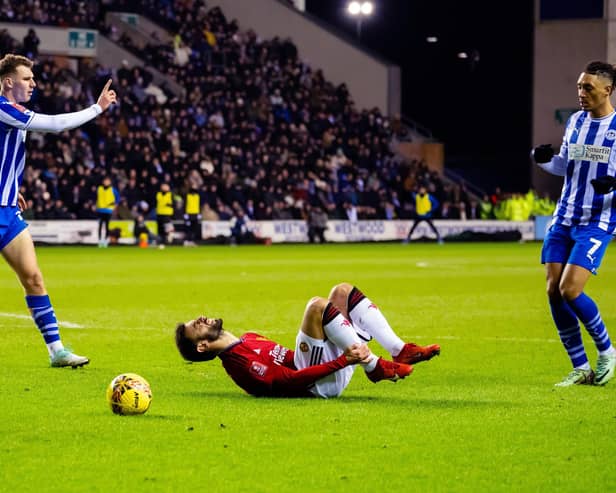 Liam Shaw concedes a penalty in the FA Cup third-round tie against Manchester United midway last January