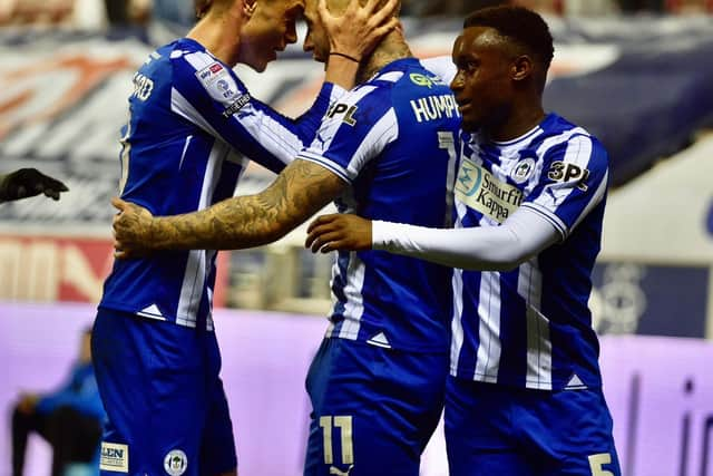 Stephen Humphrys is congratulated by Thelo Aasgaard after putting Latics in front against Oxford