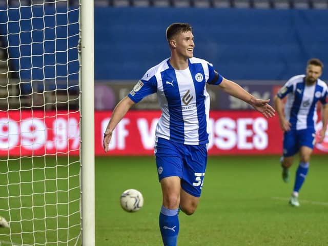 Adam Long celebrates scoring his first senior goal against Shrewsbury