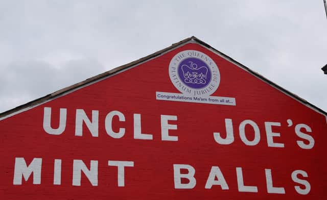 The Uncle Joe's Mint Ball sign on the side of William Santus & Co Ltd building