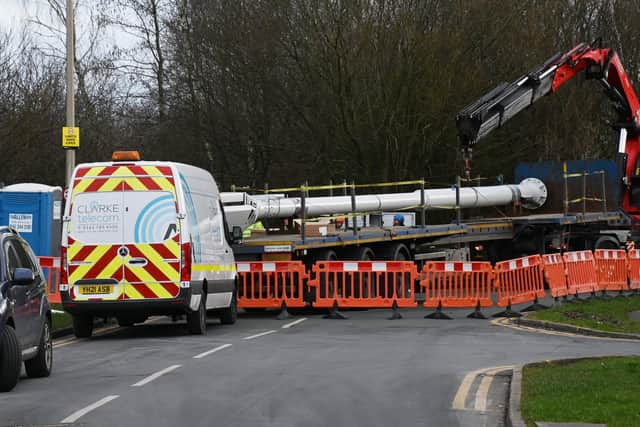 The scene on Braithwaite Road, Lowton, as the mast is brought on a lorry.