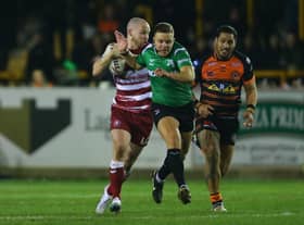 Liam Marshal is blocked by the referee