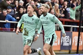 Stephen Humphrys celebrates scoring for Latics at Fleetwood last year with Thelo Aasgaard