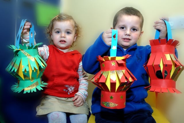 Toddlers from Hindley Sure Start Children's Centre, Isabelle Hammond and William Morgan, with lanterns made as part of Chinese New Year celebrations