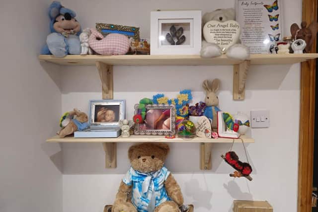 Dominic and Laura Maloney have created a memory wall, complete with a memory bear, in honour of their son Connah