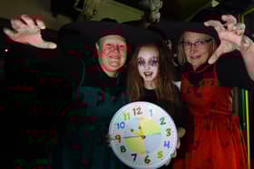 From left: Micheala Collier, Georgie Nelson, 10, and Bev Collier-Nelson at Little Buddies Play Centre, Wigan, remind you to put your clocks back an hour this Hallowe'en weekend