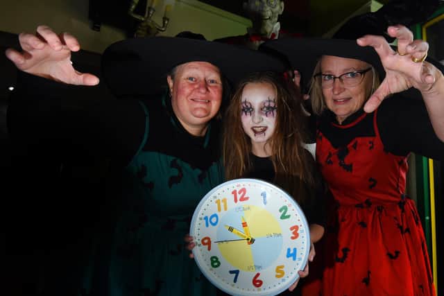 From left: Micheala Collier, Georgie Nelson, 10, and Bev Collier-Nelson at Little Buddies Play Centre, Wigan, remind you to put your clocks back an hour this Hallowe'en weekend