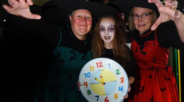 From left: Micheala Collier, Georgie Nelson, 10, and Bev Collier-Nelson at Little Buddies Play Centre, Wigan, remind you to put your clocks back an hour this Hallowe'en weekend