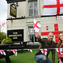 John Landon, left, landlord of The Moorgate Inn, Aspull, pictured with assistant manager Chelsea Kershaw, are getting ready to host a St George's Day party for the Royal British Legion on Saturday