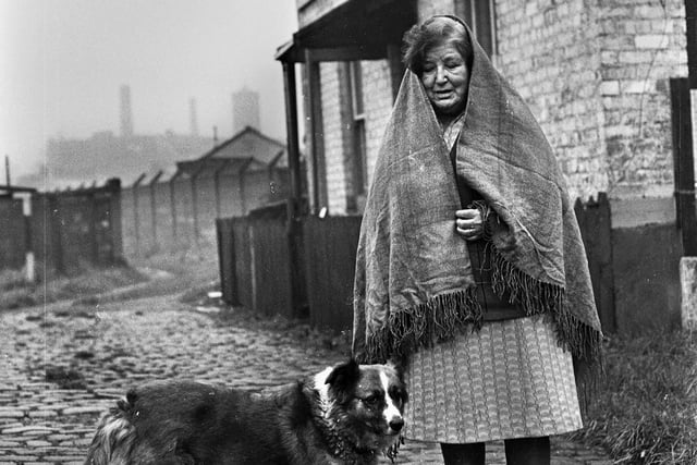 Like a scene from an earlier time but this was Mrs. Teresa Daniels outside her Wigan home in the Trencherfield Mill area in 1977.