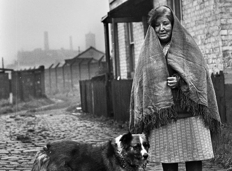 Like a scene from an earlier time but this was Mrs. Teresa Daniels outside her Wigan home in the Trencherfield Mill area in 1977.