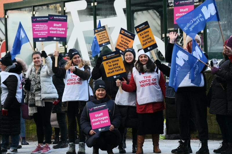 Nurses waved flags and carried placards on the picket line