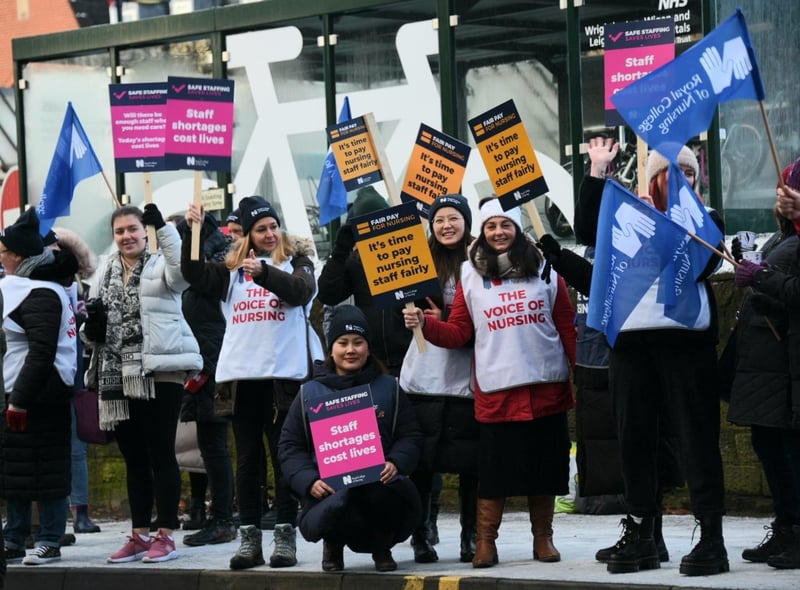 Nurses waved flags and carried placards on the picket line