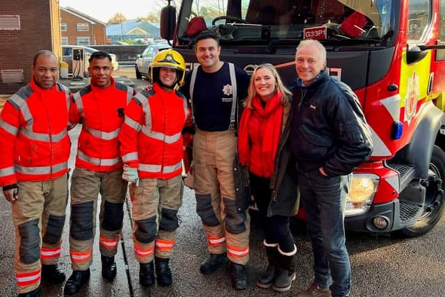 Laura Nuttall with parents Nicola and Mark, right, and firefighters at Oldham fire station