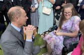 Prince Edward, the Duke of Edinburgh, speaks to trainees
