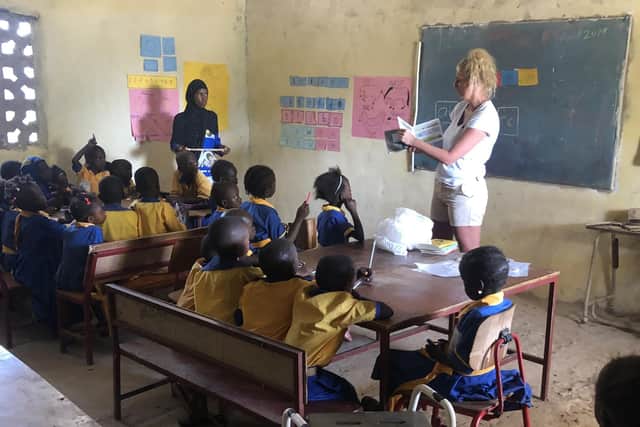 Kate Penarski teaches in a classroom in The Gambia