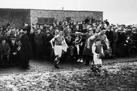 Wigan Athletic captain Dave Mycock leads the team out at Springfield Park for the FA Cup 3rd round replay against Newcastle United on Wednesday 13th of January 1954.
Lancashire Combination side Latics had drawn the first match 2-2 at St. James Park on the previous Saturday against the "Magpies" who were at the height of their glory years with a team that included legends such as Jackie Milburn, Jimmy Scoular and Ivor Broadis.
Despite two goals from centre forward Billy Lomax Latics lost 2-3 but not without a great fight.