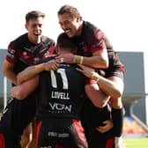 London Broncos' Will Lovell celebrates scoring a try during Summer Bash in York