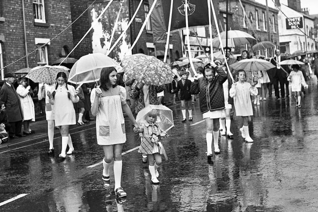 The Standish combined churches walk under way through the pouring rain on Sunday 24th of June 1973.