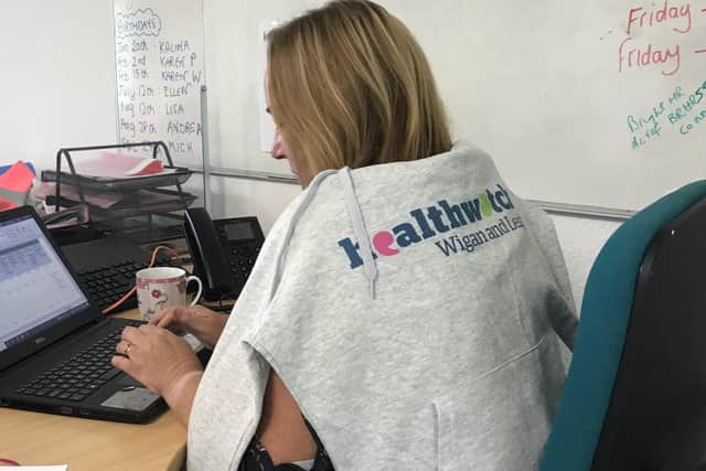 A volunteer working in the Healthwatch Wigan and Leigh office