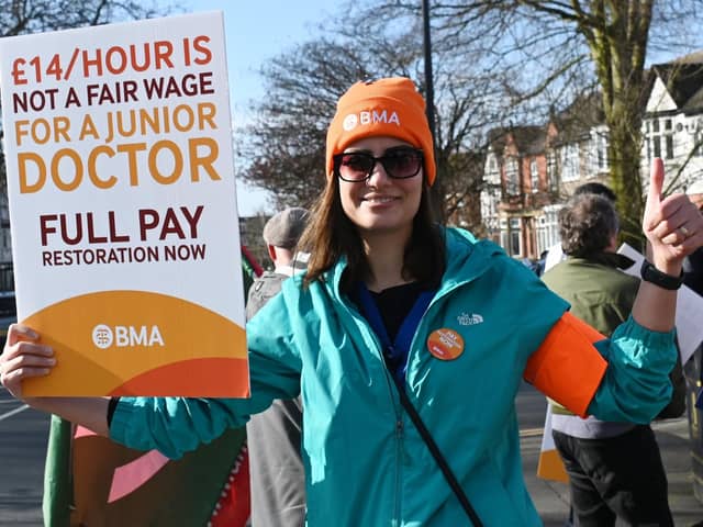 Junior doctor Behnaz Pourmohammadi on the picket line outside Wigan Infirmary