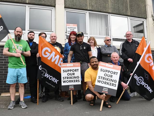 G4S security staff and supporters on a picket line outside Wigan's job centre at Brocol House during an earlier walkout