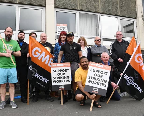 G4S security staff and supporters on a picket line outside Wigan's job centre at Brocol House during an earlier walkout