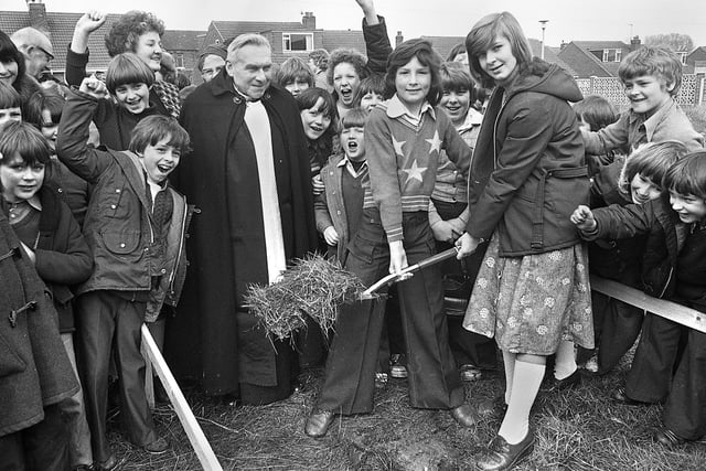 The first sod is cut on the site of the new Abram CE Primary School in Simpkin Street by 11 year old pupils, Richard Ashcroft and Carol Greenwood, on Tuesday 29th of March 1977. Presiding over matters is the vicar of St. John's, Abram, Rev. Robert Douthwaite.