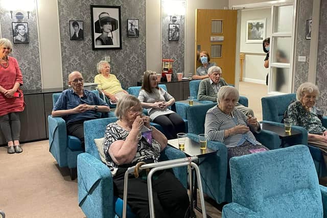 Residents at Ash Tree House at the cinema room unveiling