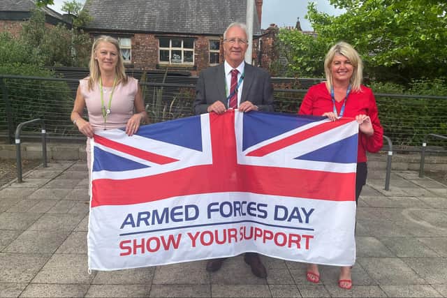 Looking forward to Armed Forces Day are Gillian Burchall, armed forces key worker, Wigan Council leader Coun David Molyneux and chief executive Alison McKenzie-Folan