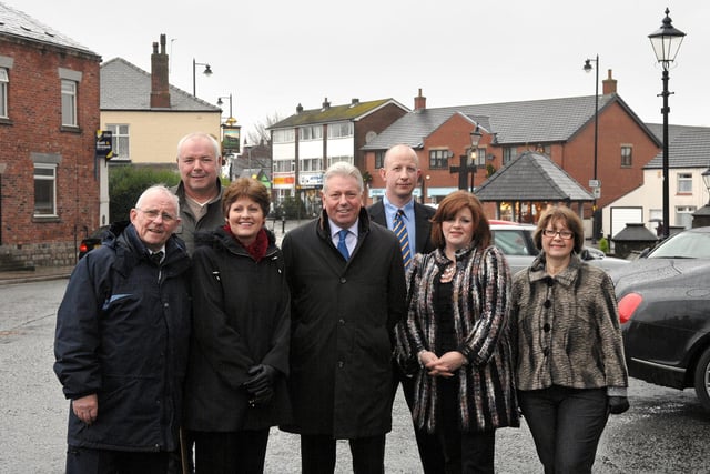 Coun George Fairhurst, left, in Standish with business people Steve Parr, Christine Martin, Martin Ainscough, Ian Thompson, Liza Stapleton and Shirley Taylor, who helped pay for Christmas trees and lights on buildings around the village