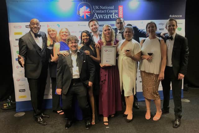 The Interact team at the UK National Contact Awards accompanied by host Ainsley Harriott (left)