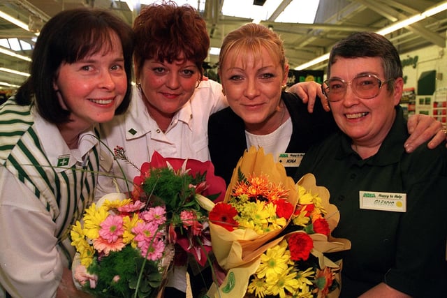 Glenys Harris, right, was saved from choking by two of her colleagues at the Asda Store in Golborne. Pictured with, from left, Marie Russell, Linda Culshaw and Customer Services Manager Nina Burns.