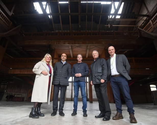 Making a tour of the Wigan Pier site: (left to right) Chief Executive of Wigan Council, Alison McKenzie-Folan, Step Places managing director Harinder Dhaliwal, GMCA night-time economy advisor, Sacha Lord, Leader of Wigan Council, David Molyneux and David Proctor assistant director for planning regeneration Wigan council.