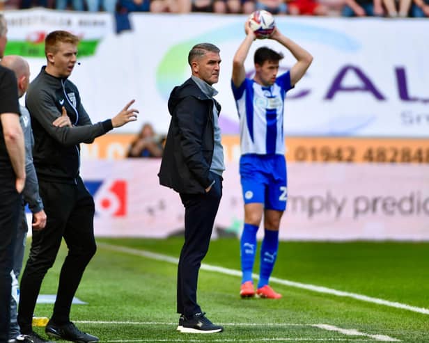 Ryan Lowe watches on as Latics went toe to tie with second-placed Wrexham
