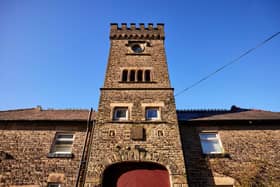 Image of the historic coach house before its restoration