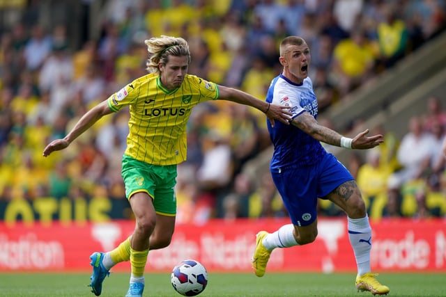 Norwich City's Todd Cantwell (left) and Wigan Athletic's Max Power battle for the ball during the Sky Bet Championship match at Carrow Road, Norwich. Picture date: Saturday August 6, 2022. PA Photo: Joe Giddens/PA Wire.